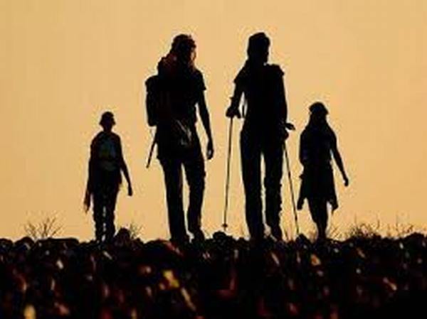 a family gorup walking along the cammino di santiago