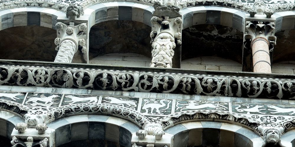 details of the facade of church saint michael in Lucca