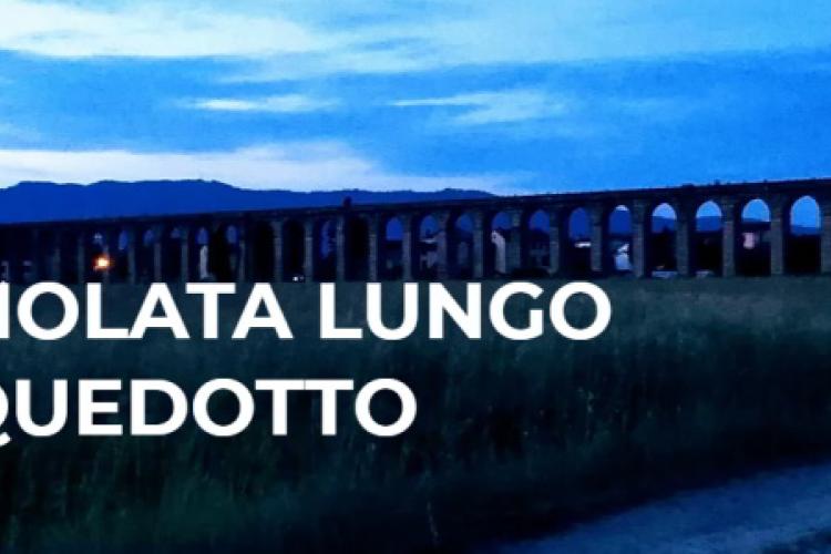 Lucciolata lungo l'acquedotto Nottolini - Immagine dell'acquedotto al tramonto